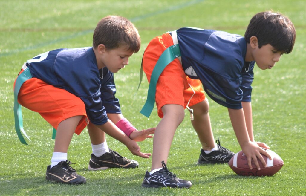 Parents have to make a decision between flag football and tackle football.